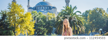 Woman tourist enjoying the view Blue Mosque, Sultanahmet Camii, Istanbul, Turkey BANNER, LONG FORMAT 112454503