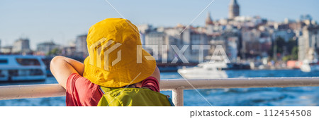 Happy boy enjoying the sea from ferry boat crossing Bosphorus in Istanbul. Summer trip to Istanbul. Traveling with kids concept BANNER, LONG FORMAT Happy boy enjoying the sea from ferry boat crossing Bosphorus in Istanbul. Summer trip to Istanbul. Traveling with kids concept BANNER, LONG FORMAT 112454508