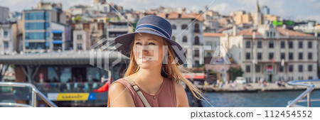 Happy woman enjoying the sea from ferry boat crossing Bosphorus in Istanbul. Summer trip to Istanbul BANNER, LONG FORMAT 112454552