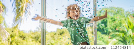 Happy Little happy cute boy throwing colorful confetti BANNER, LONG FORMAT Happy Little happy cute boy throwing colorful confetti BANNER, LONG FORMAT 112454814