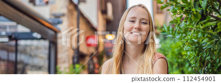 BANNER, LONG FORMAT Happy woman tourist on background of old street of Antalya. female tourist traveler discover interesting places and popular attractions and walks in the old city Kalechi of Antalya BANNER, LONG FORMAT Happy woman tourist on background of old street of Antalya. female tourist traveler discover interesting places and popular attractions and walks in the old city Kalechi of Antalya 112454901