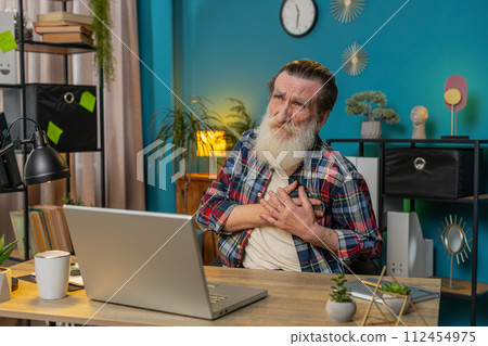 Senior old man freelancer suffers from tension holding chest with heart pain attack risk of stroke Senior old man freelancer suffers from tension holding chest with heart pain attack risk of stroke 112454975