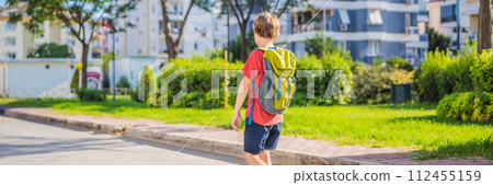 Little boy with a backpack go to school. Back view BANNER, LONG FORMAT Little boy with a backpack go to school. Back view BANNER, LONG FORMAT 112455159