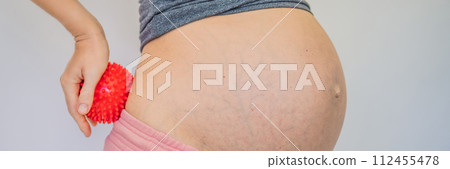 Self-massage with a massager for a pregnant woman BANNER, LONG FORMAT Self-massage with a massager for a pregnant woman BANNER, LONG FORMAT 112455478