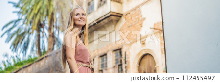 Woman tourist in Old town Kaleici in Antalya. Turkiye. Panoramic view of Antalya Old Town port, Taurus mountains and Mediterrranean Sea, Turkey BANNER, LONG FORMAT Woman tourist in Old town Kaleici in Antalya. Turkiye. Panoramic view of Antalya Old Town port, Taurus mountains and Mediterrranean Sea, Turkey BANNER, LONG FORMAT 112455497