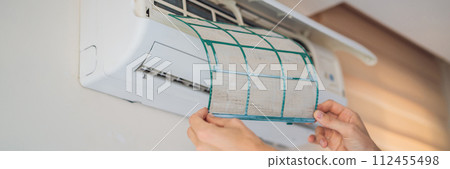 cleen out dust from air conditioner filter BANNER, LONG FORMAT 112455498