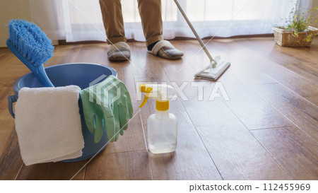 Cleaning tools | Person cleaning the floor with a wiper 112455969