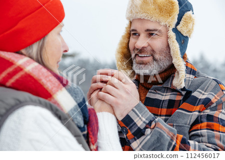 Happy mature couple spending time outdoors and looking in love 112456017