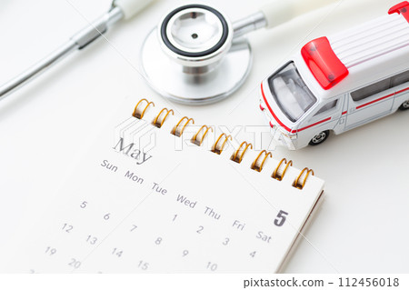 May calendar with stethoscope and ambulance 112456018