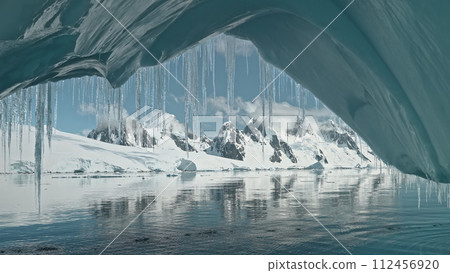 Antarctica mountain landscape from glacier arch aerial. Ecology problem of global warming. Environment protection from climate change at South Pole. Cinematic ice and snow covered lands 112456920