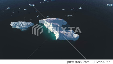 Wildlife in Antarctica, seals resting on floating glacier. Mammal ocean animals in the wild. Arctic winter nature. Leopard seals lying on pure ice in cold water, sunny day. Aerial drone view panorama Wildlife in Antarctica, seals resting on floating glacier. Mammal ocean animals in the wild. Arctic winter nature. Leopard seals lying on pure ice in cold water, sunny day. Aerial drone view panorama 112456956