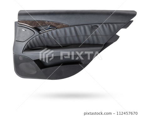 Car door trim with black fabric upholstery on a white isolated background for repair and replacement in a car service. Spare parts catalog. Car door trim with black fabric upholstery on a white isolated background for repair and replacement in a car service. Spare parts catalog. 112457670