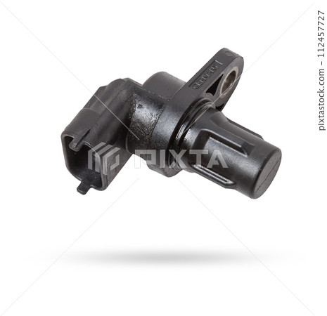 Electromagnetic crankshaft position sensor of a car engine in the hands of an auto mechanic. Spare parts catalog. Electromagnetic crankshaft position sensor of a car engine in the hands of an auto mechanic. Spare parts catalog. 112457727