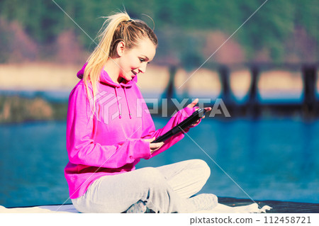 Girl working outside in park. 112458721