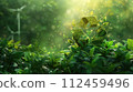 Green recycling symbol with sunrise over a field with wind turbines. Green energy solutions and sustainable power engineering and eco-friendly technology. Generative AI 112459496