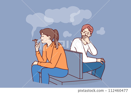 Woman smokes sitting in public place and causes inconvenience to man, making him passive smoker 112460477