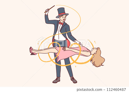 Man magician demonstrates magic trick by making woman assistant levitate during circus performance 112460487