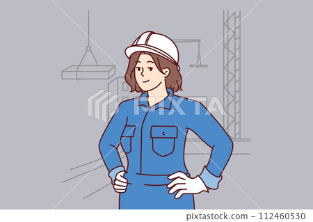 Woman builder stands on construction site near multi-story buildings and tower cranes lifting slabs 112460530