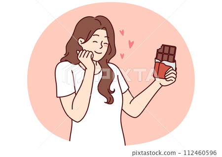 Happy woman enjoying taste of dark chocolate using sweet dessert for snacking and removing hunger Happy woman enjoying taste of dark chocolate using sweet dessert for snacking and removing hunger 112460596
