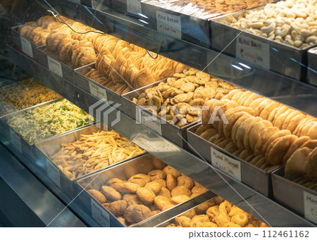 Traditional Indian snacks namkeen in pastry shop and street food on markets Traditional Indian snacks namkeen in pastry shop and street food on markets 112461162