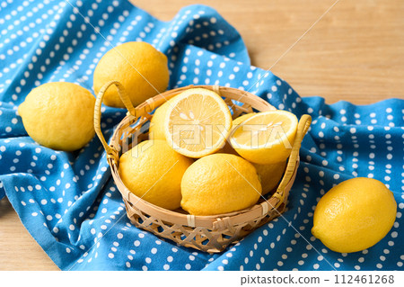 Domestic lemons in a basket 112461268