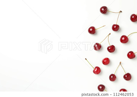 Ripe juicy cherry fruits on a white background 112462053