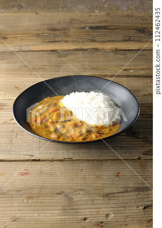 Hot curry rice with plenty of vegetables such as pork, pumpkin, and carrots. Hot curry rice with plenty of vegetables such as pork, pumpkin, and carrots. 112462435