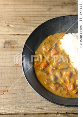 Hot curry rice with plenty of vegetables such as pork, pumpkin, and carrots. Hot curry rice with plenty of vegetables such as pork, pumpkin, and carrots. 112462451