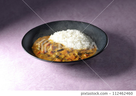 Hot curry rice with plenty of vegetables such as pork, pumpkin, and carrots. Hot curry rice with plenty of vegetables such as pork, pumpkin, and carrots. 112462460