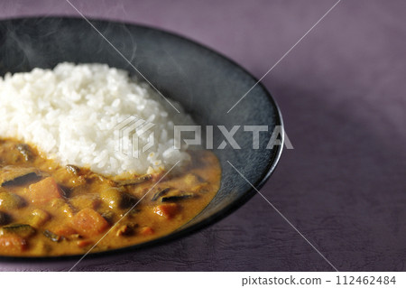 Hot curry rice with plenty of vegetables such as pork, pumpkin, and carrots. Hot curry rice with plenty of vegetables such as pork, pumpkin, and carrots. 112462484
