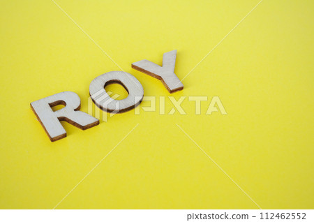 ROI wooden letters representing Remainder Of Year on yellow background ROI wooden letters representing Remainder Of Year on yellow background 112462552