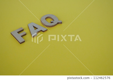 FAQ wooden letters on yellow background. Question and Answer concept FAQ wooden letters on yellow background. Question and Answer concept 112462576