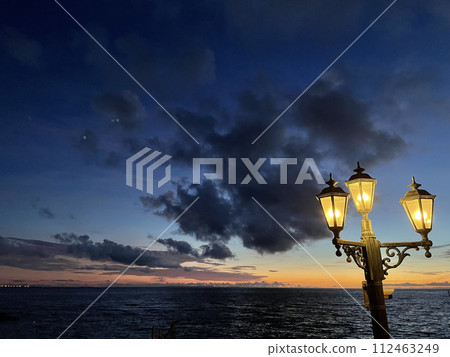 Coast with street, sunset view 112463249