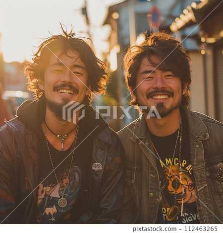 With a bearded male friend in the setting sun With a bearded male friend in the setting sun 112463265