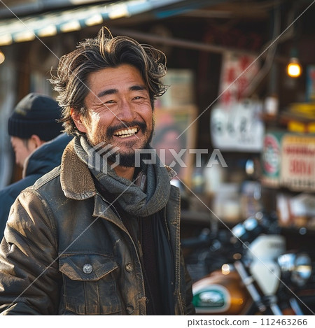 Bearded Japanese man in his 40s wearing a leather jacket Bearded Japanese man in his 40s wearing a leather jacket 112463266