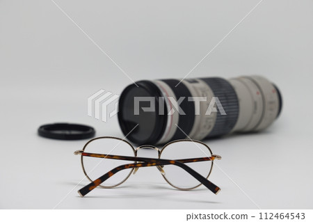 Camera, money, glasses, lens and Travel concept image Camera, money, glasses, lens and Travel concept image 112464543