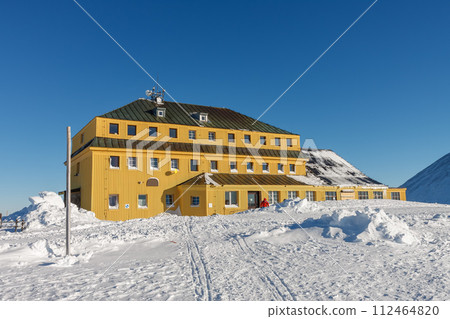 Silesian house at the foot of Snezka, krkonose mountains. Snezka is mountain on the border between Czech Republic and Poland. Silesian house at the foot of Snezka, krkonose mountains. Snezka is mountain on the border between Czech Republic and Poland. 112464820