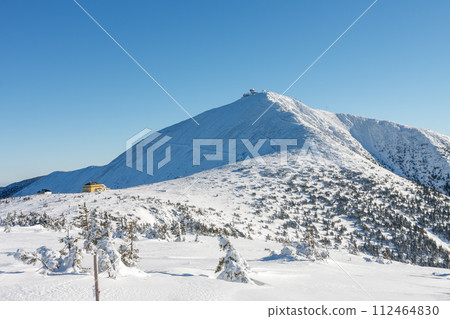 Winter morning, Silesian house, located at the foot of Snezka, krkonose mountains. Snezka is mountain on the border between Czech Republic and Poland. Winter morning, Silesian house, located at the foot of Snezka, krkonose mountains. Snezka is mountain on the border between Czech Republic and Poland. 112464830