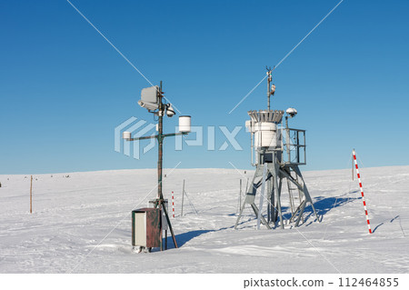 Meteorological weather station, wind meter in front of Meadow Hut, krkonose mountains, winter morning. Meteorological weather station, wind meter in front of Meadow Hut, krkonose mountains, winter morning. 112464855