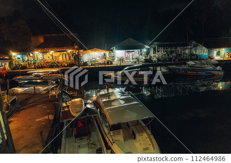 Fisherman's village at the canal by the sea at night Fisherman's village at the canal by the sea at night 112464986