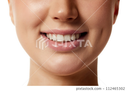 Close up photo of young attractive woman smiling with wide and healthy smile against white studio background. 112465302
