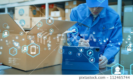 Workers inspecting goods at a distribution warehouse and technology image 112465744