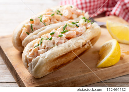 Lobster roll on wooden table 112466582