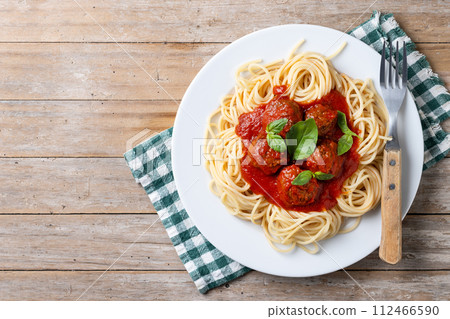 Spaghetti with meatballs on wooden table Spaghetti with meatballs on wooden table 112466590