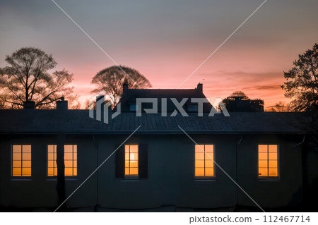 sunset on the roof of the house sunset on the roof of the house 112467714