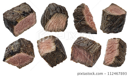 Medium rare steak pieces, sliced grilled beef cubes isolated on white background with clipping path 112467893