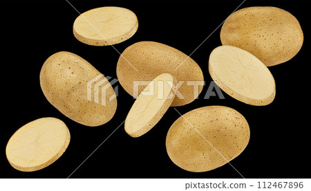 Whole and sliced potatoes isolated on black background 112467896