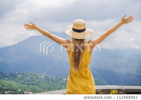 Woman traveler looking at Batur volcano. Indonesia Woman traveler looking at Batur volcano. Indonesia 112468081