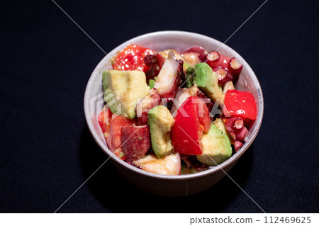 Marinated avocado and tomato 112469625