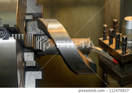The lathe machine finish cutting the cast iron parts. The lathe machine finish cutting the cast iron parts. 112470927